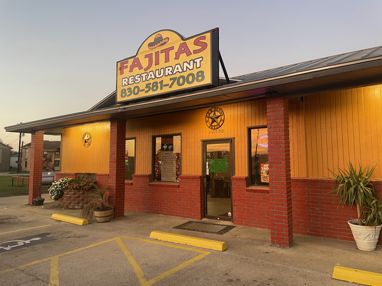 Fajitas Restaurant storefront at dusk in La Vernia, Texas
